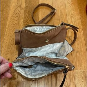 Suede, dark tan, multi pockets, gold zippers.